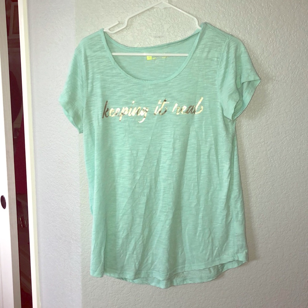 A T-shirt that has words on the front.